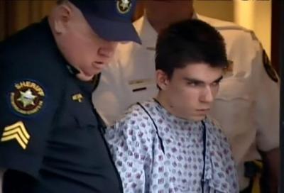 A still image from video footage courtesy WPXI-TV shows stabbing suspect Alex Hribal dressed in a hospital gown after his arraignment with Sheriff's deputies in Export, Pennsylvania April 9, 2014.