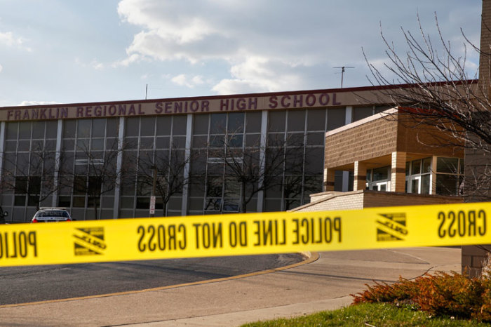 Police tape is seen outside Franklin Regional High School after a series of knife attacks in Murrysville, Pennsylvania April 9, 2014. A 16-year-old student wielding two knives went on a stabbing rampage in the hallways of the Pittsburgh-area high school early on Wednesday, injuring 21 people before he was tackled by an assistant principal, officials said.