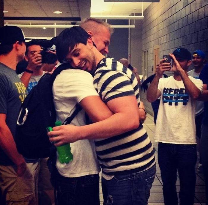 Founder and youth pastor of The Basement Matt Pitt (r) hugs a supporter shortly after his release from the Shelby County Jail in Alabama on Sunday April 13, 2014.