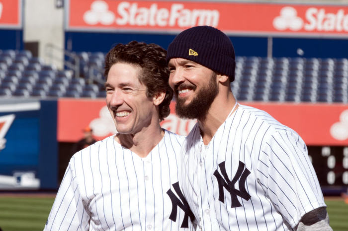 Pastor Joel Osteen of Lakewood Church in Houston, Texas, poses for a photo with Hillsong NYC Pastor Carl Lentz on Wednesday, April 9, 2014, at Yankee Stadium in the NYC borough of the Bronx.