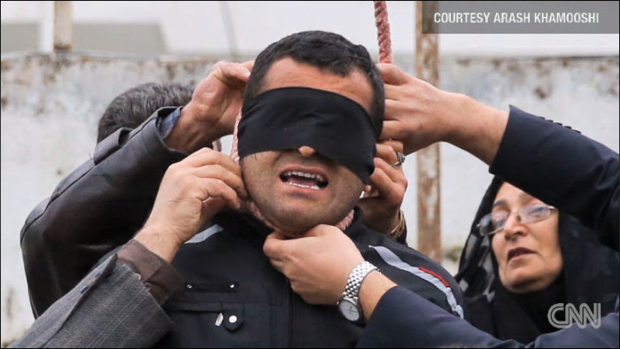 A noose is removed from Balal's neck after the parents of an 18-year-old man he killed seven years ago forgave him them spared him from a public execution in Iran.