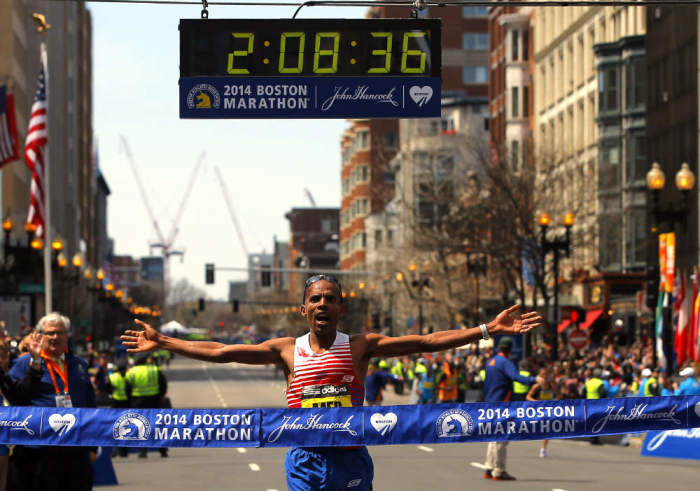 Meb Keflezighi of the U.S. reacts as he comes to the finish line at the 118th running of the Boston Marathon in Boston, Mass., on April 21, 2014.