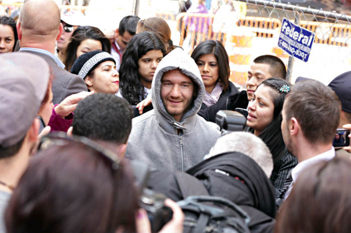 Christian evangelist Nick Vujicic gives out hugs Wednesday, April 16, 2014, in New York City's Times Square.