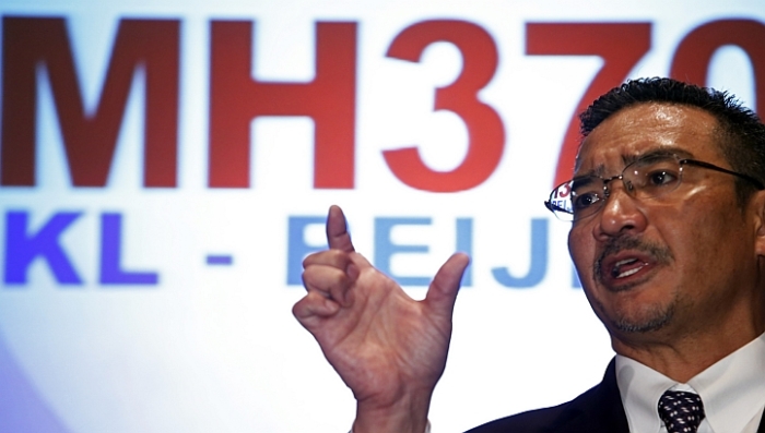 Malaysia's acting Transport Minister Hishammuddin Hussein answers questions during a news conference about the missing Malaysia Airlines MH370 plane at Kuala Lumpur International Airport on March 12, 2014.