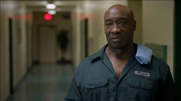 The late Michael Clarke Duncan as “Roger” in FROM THE ROUGH.