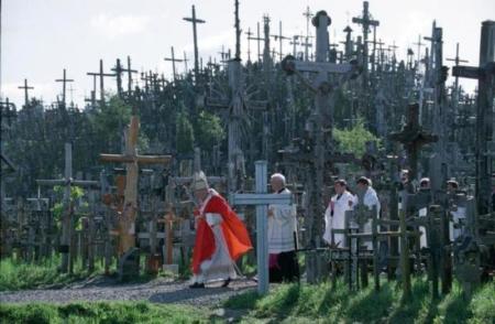 Pope John Paul II walks by the "Hill of Crosses" on his way to celebrate an outdoor mass in Siauliai on Sept. 7, 1993, during his first trip to the countries of the former Soviet Union. Thousands of crosses were erected by Lithuanians in defiance of the communist Soviet regime.