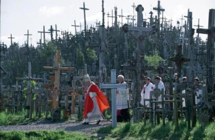 Pope John Paul II walks by the 'Hill of Crosses' on his way to celebrate an outdoor mass in Siauliai on Sept. 7, 1993, during his first trip to the countries of the former Soviet Union. Thousands of crosses were erected by Lithuanians in defiance of the communist Soviet regime.