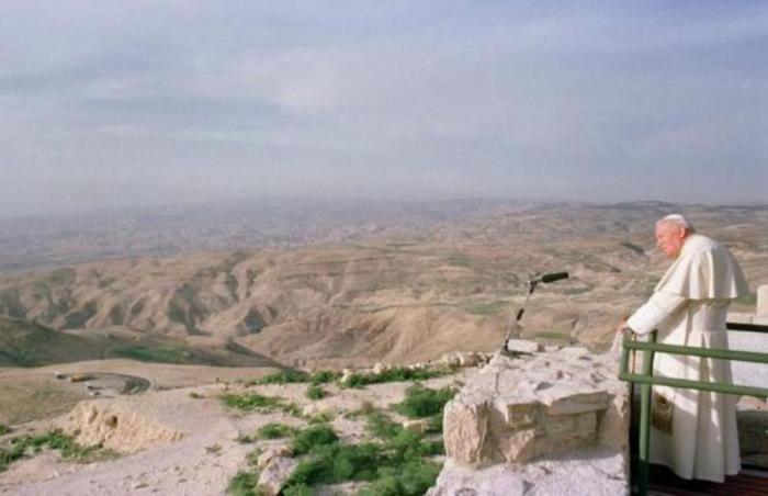 Pope John Paul II stands on top of Mount Nebo, Jordan, March 20, 2000, where tradition says Moses first glimpsed the Promised Land.