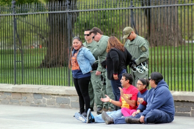 Immigration-reform activists are arrested outside of the White House after protesting the nearly 2 million people who have been deported under President Obama's administration.
