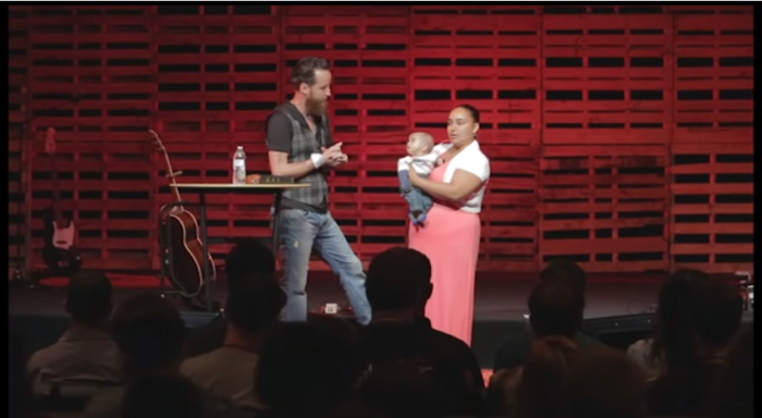 Jeff Durbin (l) invites Tina (r), the woman he convinced to not abort her baby, to join him onstage at the 2014 Ignite conference.