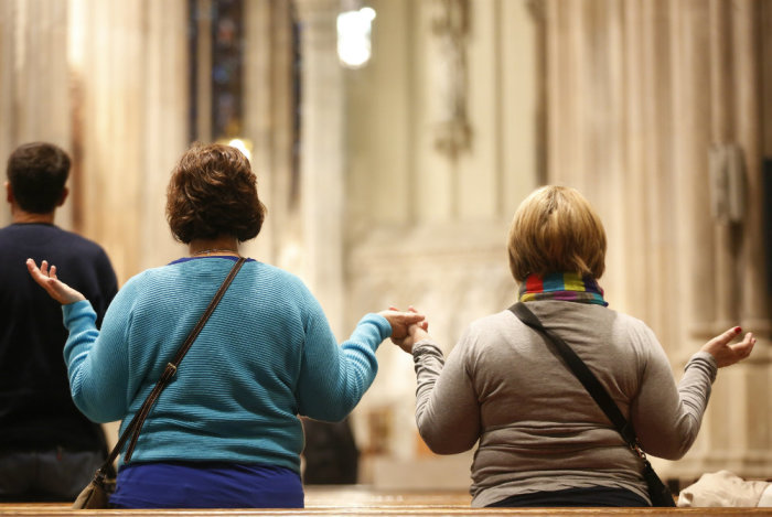 Catholics pray during a mass at St. Patrick's Cathedral in New York, Feb. 11, 2013.
