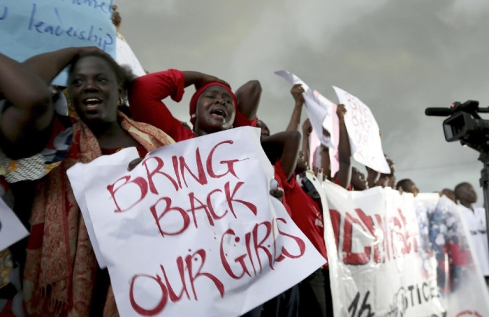 Women react during a protest on April, 30, 2014, outside Nigeria's Parliament in Abuja demanding that security forces search harder for 200 school girls abducted by Islamist militants two weeks ago.
