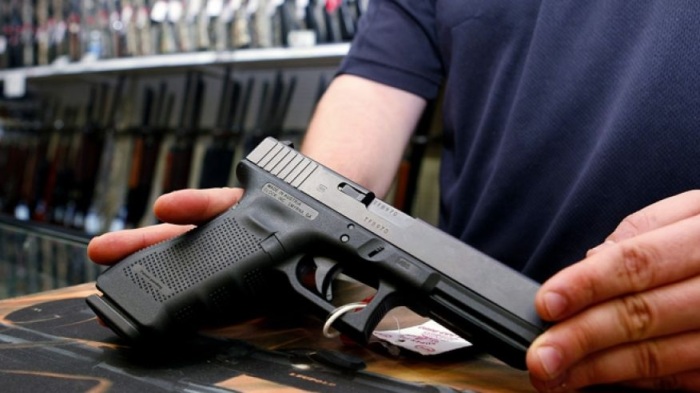 A glock handgun available in a raffle promotion is shown at Adventures Outdoors in Smyrna, Georgia, Oct. 25, 2012.