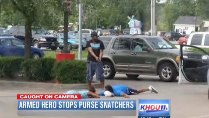 An armed good Samaritan subdues two crooks from snatching the purse of a mother.