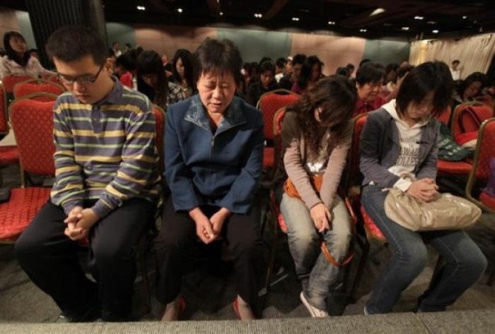 Christians attend Sunday service at Shouwang Church in Beijing in this file photo from October 3, 2010.