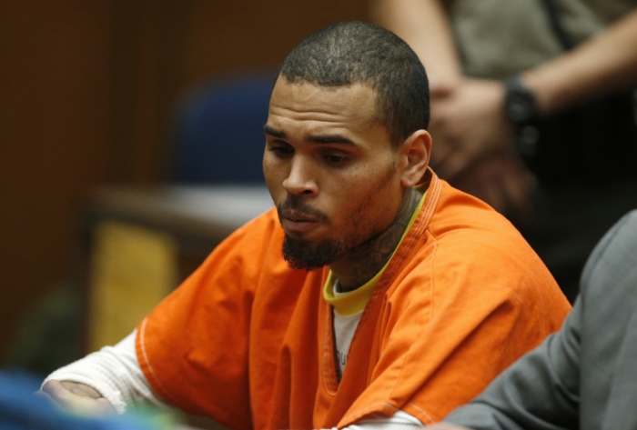 R&B singer Chris Brown, who pleaded guilty to assaulting his girlfriend Rihanna, appears in court for allegedly violating his probation, in Los Angeles, California, March 17, 2014.