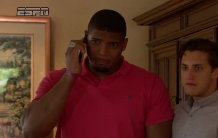 Saint Louis Rams' draft pick Michael Sam and his boyfriend Vito Cammisano wait to hear if the Missouri player has been drafted on May 10, 2014.
