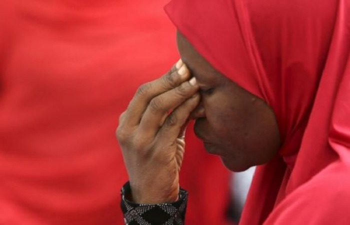 A woman takes part in a protest for the release of the abducted school girls in the village of Chibok in Nigeria during a sit-in protest at the Unity fountain in Abuja, May 12, 2014.