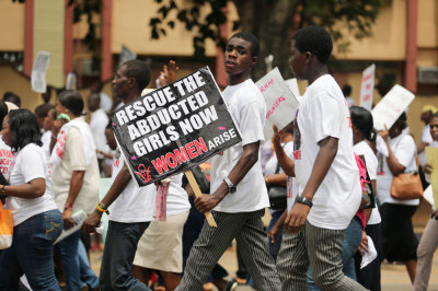 Students join a protest demanding the release of the abducted secondary school girls in the remote village of Chibok, along a road in Lagos May 12, 2014.
