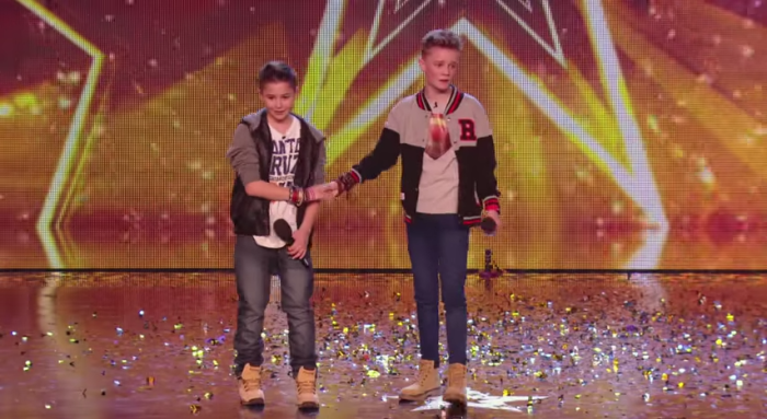 Musical duo Charlie Lenehan, 15 (r), and Leondre Devries, 13 (l) of Bars & Melody react on 'Britain's Got Talent' after judge Simon Cowell gave them his Golden Buzzer.