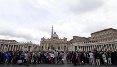People line up to visit St. Peter’s Basilica at the Vatican, April 24, 2014.