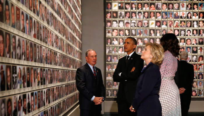 U.S. President Barack Obama (2nd L), former New York Mayor Michael Bloomberg (L), first lady Michelle Obama (2nd R), former U.S. President Bill Clinton (R) and his wife, former Secretary of State Hillary Clinton look at the faces of those who died during the 9/11 attacks, at the National September 11 Memorial Museum in New York May 15, 2014. The museum, memorializing the September 11, 2001 attacks, opens this week to victims' family members and next week to the public, displaying artifacts from mangled columns recalling the enormity of that fateful day to shattered eyeglasses recalling its personal pain.