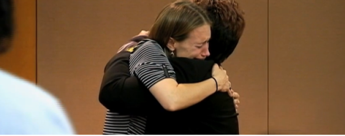 Sandra Walker (l) hugs Tamara Matthews (r) after Matthews was sentenced.