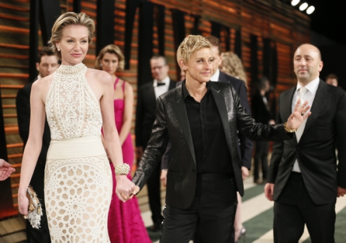 Actress Portia de Rossi (L) and her wife, Oscar host Ellen DeGeneres, arrive at the 2014 Vanity Fair Oscars Party in West Hollywood, Calif. (March 2, 2014)