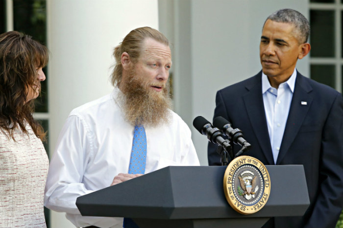 President Barack Obama watches as Jami Bergdahl (L) and Bob Bergdahl (C) talk about the release of their son, prisoner of war U.S. Army Sergeant Bowe Bergdahl, during a statement in the Rose Garden at the White House in Washington, D.C., on May 31, 2014.