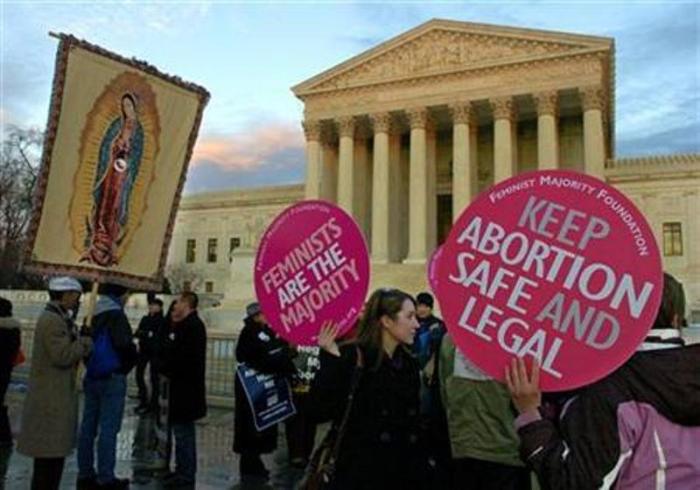 Pro-abortion demonstrators (R) share the plaza with pro-life demonstrators (L) in front of the Supreme Court to mark the 35th anniversary of Roe v. Wade, the landmark legislation which allowed abortion, during a rally in Washington, Jan. 22, 2008.