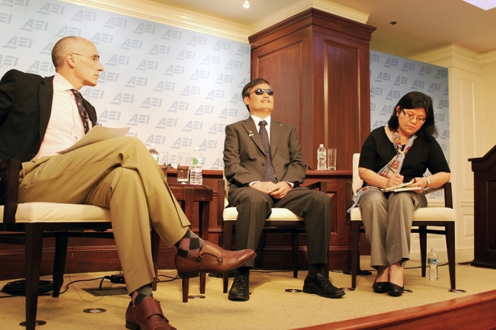 Arthur Brooks (left) speaking to Chen Guangcheng (middle) with an interpreter (right) for an American Enterprise Institute event marking the 25th anniversary of the Tiananmen Square Massacre, June 3, 2014, Washington, D.C.
