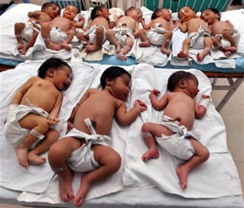 Newly born babies rest inside a ward at a hospital on the occasion of "World Population Day" in the northern Indian city Lucknow in this file picture taken July 11, 2009.