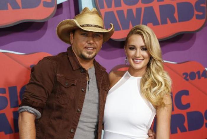 Musician Jason Aldean and guest arrive at the 2014 CMT Music Awards in Nashville, Tennessee June 4, 2014.