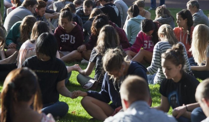 Students pray together after a shooting on campus at Seattle Pacific University in Washington June 5, 2014
