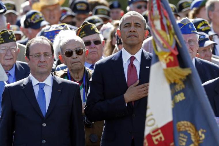 President Obama and French President Francois Hollande participate in the 70th French-American Commemoration D-Day Ceremony at the Normandy American Cemetery and Memorial in Colleville-sur-Mer June 6, 2014.