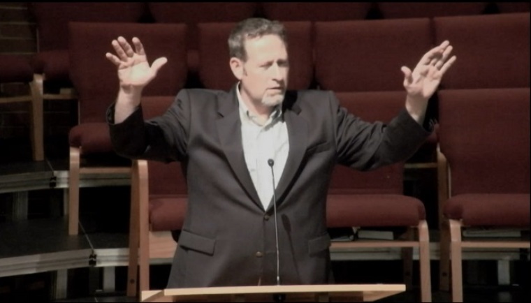 Senior Pastor of First Free Methodist Church Blake Wood blesses students at Seattle Pacific University on June 6, 2014.