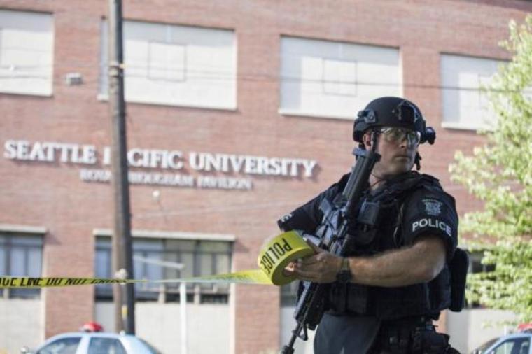 A policeman secures the scene at Seattle Pacific University after the campus was evacuated due to a shooting in Seattle, Washington, June 5, 2014.