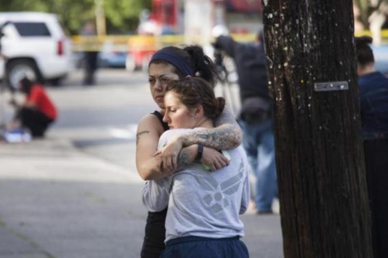 Rana Levy (L) hugs Christine Smith (R) at Seattle Pacific University after a shooting on the campus that left their friends injured in Seattle, Washington, June 5, 2014.