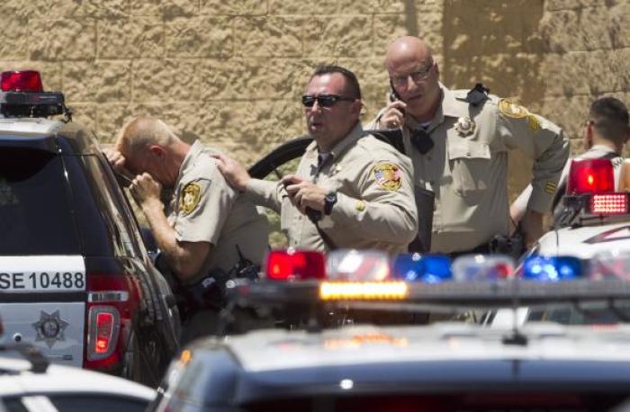 Metro Police officers are shown outside a Wal-Mart after a shooting in Las Vegas, June 8, 2014.