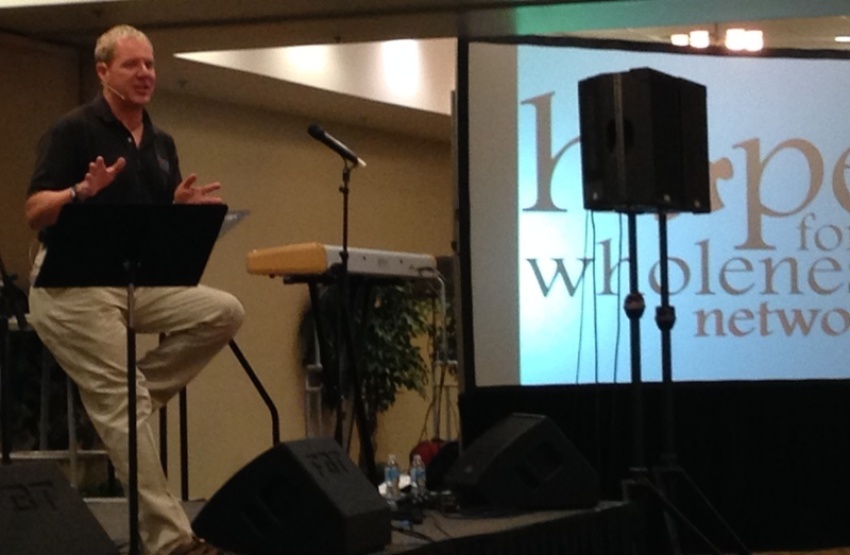McKrae Game, president and founder of Hope for Wholeness, speaks at the organization's first four-day national conference, 