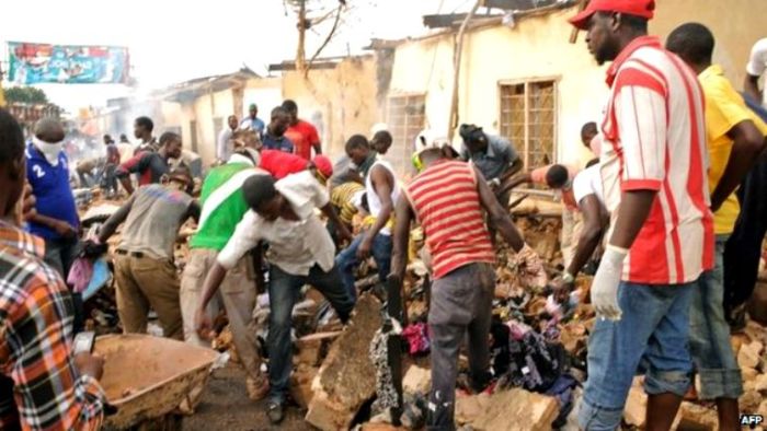 Rescue workers on Wednesday were digging through rubble, searching for more victims of the two explosions that hit the city of Jos on May 20, 2014.