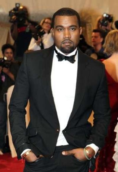 Singer Kanye West poses on arrival at the Metropolitan Museum of Art Costume Institute Benefit celebrating the opening of Alexander McQueen: Savage Beauty, in New York May 2, 2011.