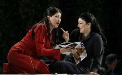 Singers Nadia Krasteva (L) and Tamar Iveri (R) perform on stage as Olga and Tatjana during a dress rehearsal of Pyotr Illyich Tchaikovsky's opera Eugene Onegin at Vienna's State Opera March 3, 2009.