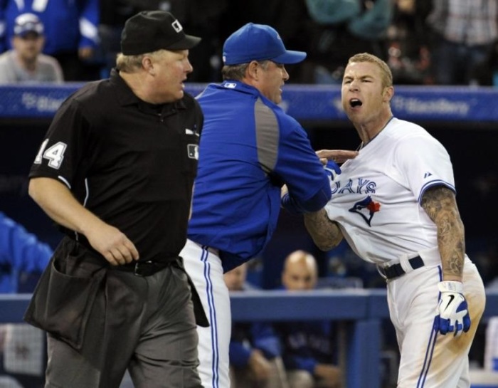 The Blue Jays' Brett Lawrie being held back on May 15, 2014.