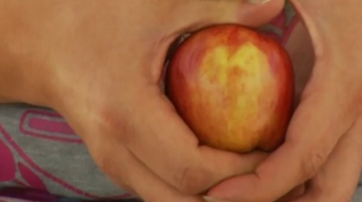 David Durant of Albuquerque, New Mexico holds his unique apple that he thinks shows an image of Jesus holding a lamb.