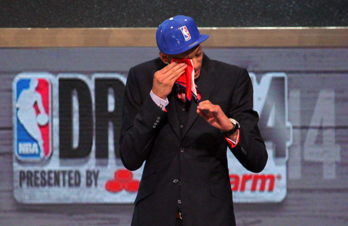 Isaiah Austin (Baylor) wipes a tear from his eye after being selected as an honorary draft pick by the NBA during the 2014 NBA Draft at the Barclays Center. Austin was diagnosed with Marfan Syndrome ending his career.