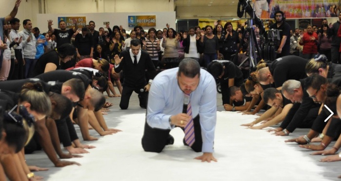 Pastor Agenor Duke of Igreja Apostolica Plenitude Do Trono De Deu in Sao Paulo, Brazil prays over 110 lbs. of salt during a church service.