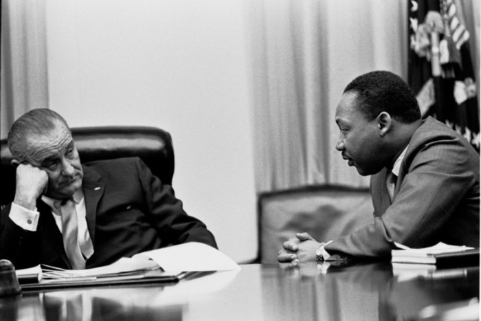 President Lyndon B. Johnson speaks to Martin Luther King Jr. in an undated photo before Congress passed the Voting Rights Act in 1965.