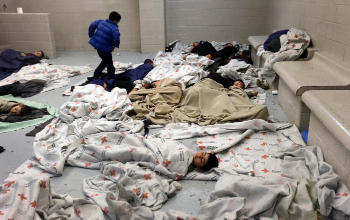 Child detainees sleep in a holding cell at a US Customs and Border Protection processing facility in Brownsville, Texas.