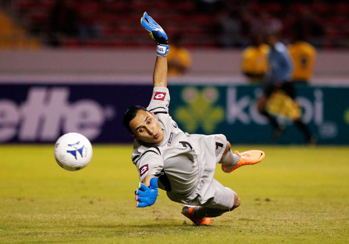 Costa Rica's Keylor Navas makes a save against Paraguay during their international friendly soccer match at the National stadium in San Jose March 5, 2014.